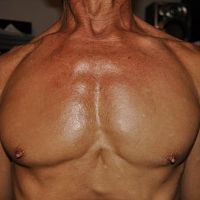 Chest relaxed, inhaling a breath