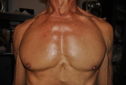 Chest relaxed, inhaling a breath